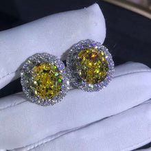 Load image into Gallery viewer, 15 Carat TW Yellow Oval Cut Halo VVS Moissanite Stud Earrings