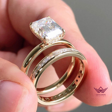 Load image into Gallery viewer, Medium Emerald Cut Hidden Halo Basket Tension Band D Color Two-Piece Moissanite Bridal Set