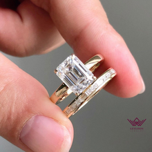 Load image into Gallery viewer, Medium Emerald Cut Hidden Halo Basket Tension Band D Color Two-Piece Moissanite Bridal Set