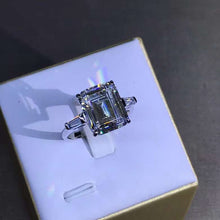 Load image into Gallery viewer, 5 Carat Emerald Cut Moissanite Ring Three Stone Basket VVS G-H Colorless